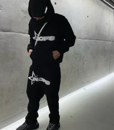 person wearing black tracksuit urban style