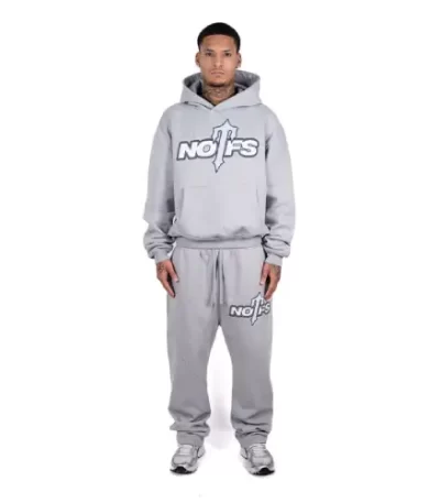 person wearing grey trapstar nofs tracksuit