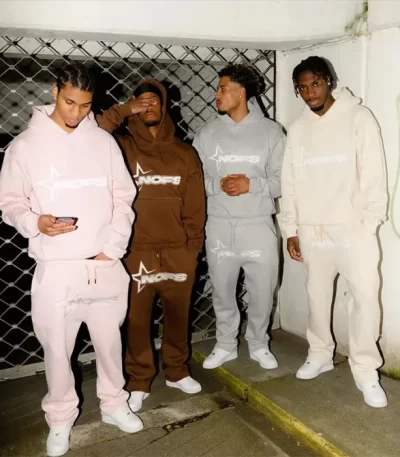 person wearing light grey tracksuit urban