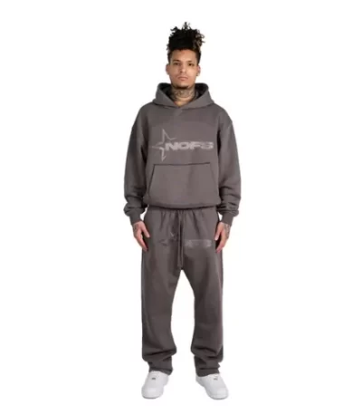 person wearing dark grey tracksuit