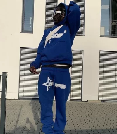person wearing blue tracksuit urban style